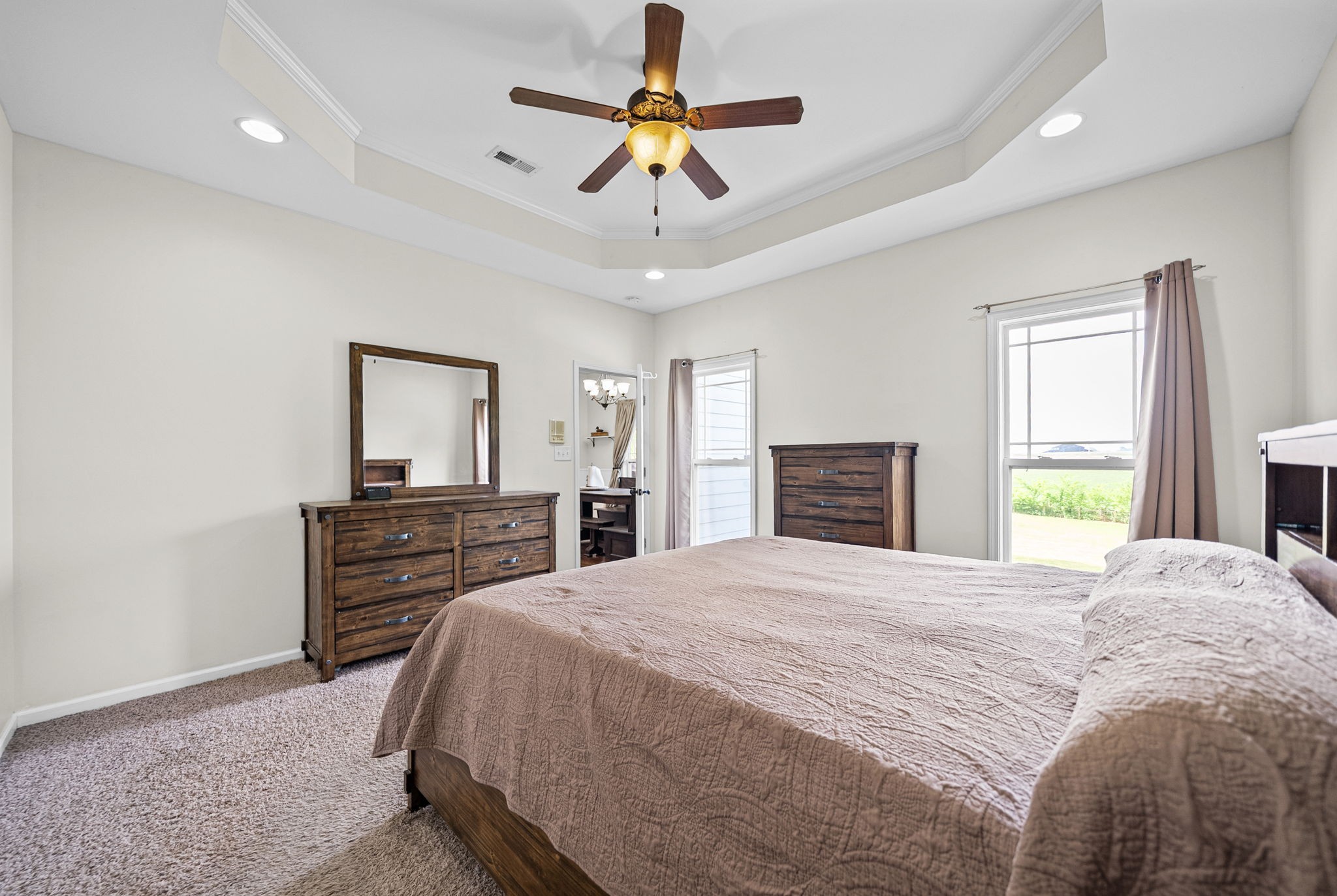 195 Barkers Mill Road Pembroke, KY 42266 - Photo 15 of 39 a bedroom with a bed and a chandelier