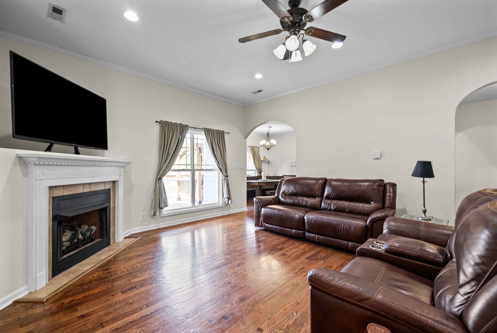 195 Barkers Mill Road Pembroke, KY 42266 - Photo 3 of 39 a living room with furniture a fireplace and a flat screen tv