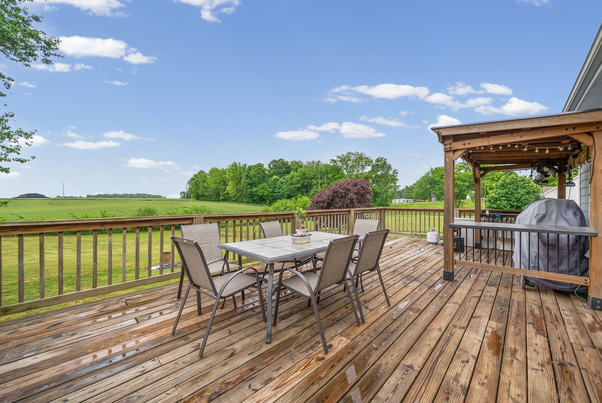 195 Barkers Mill Road Pembroke, KY 42266 - Photo 33 of 39 a view of a deck with two chairs and a table