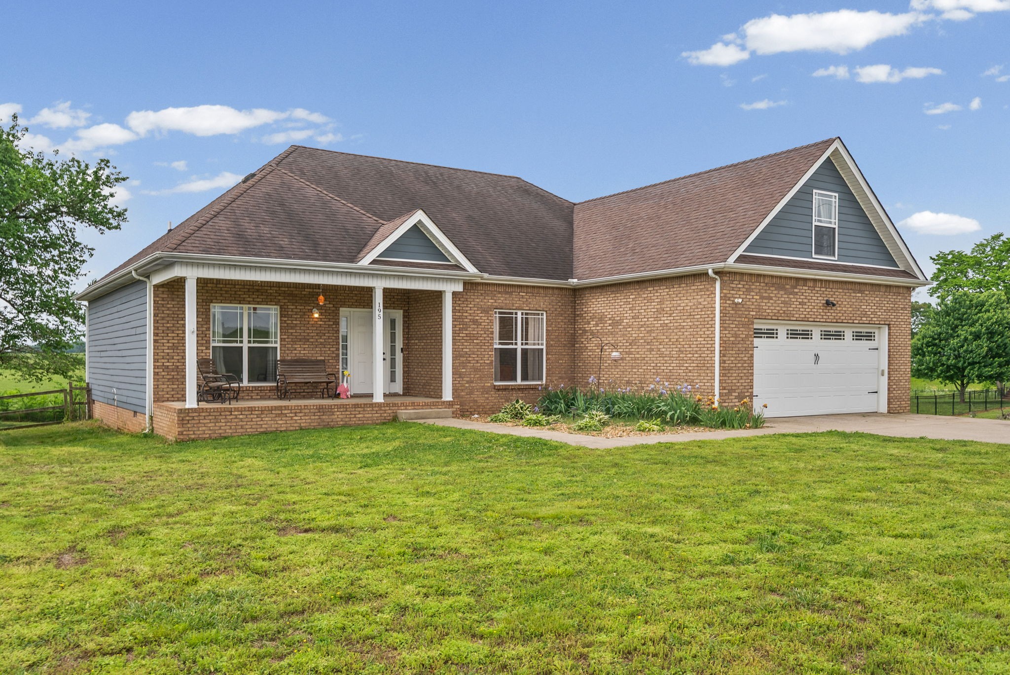 195 Barkers Mill Road Pembroke, KY 42266 - Photo 36 of 39 a front view of a house with a yard and garage
