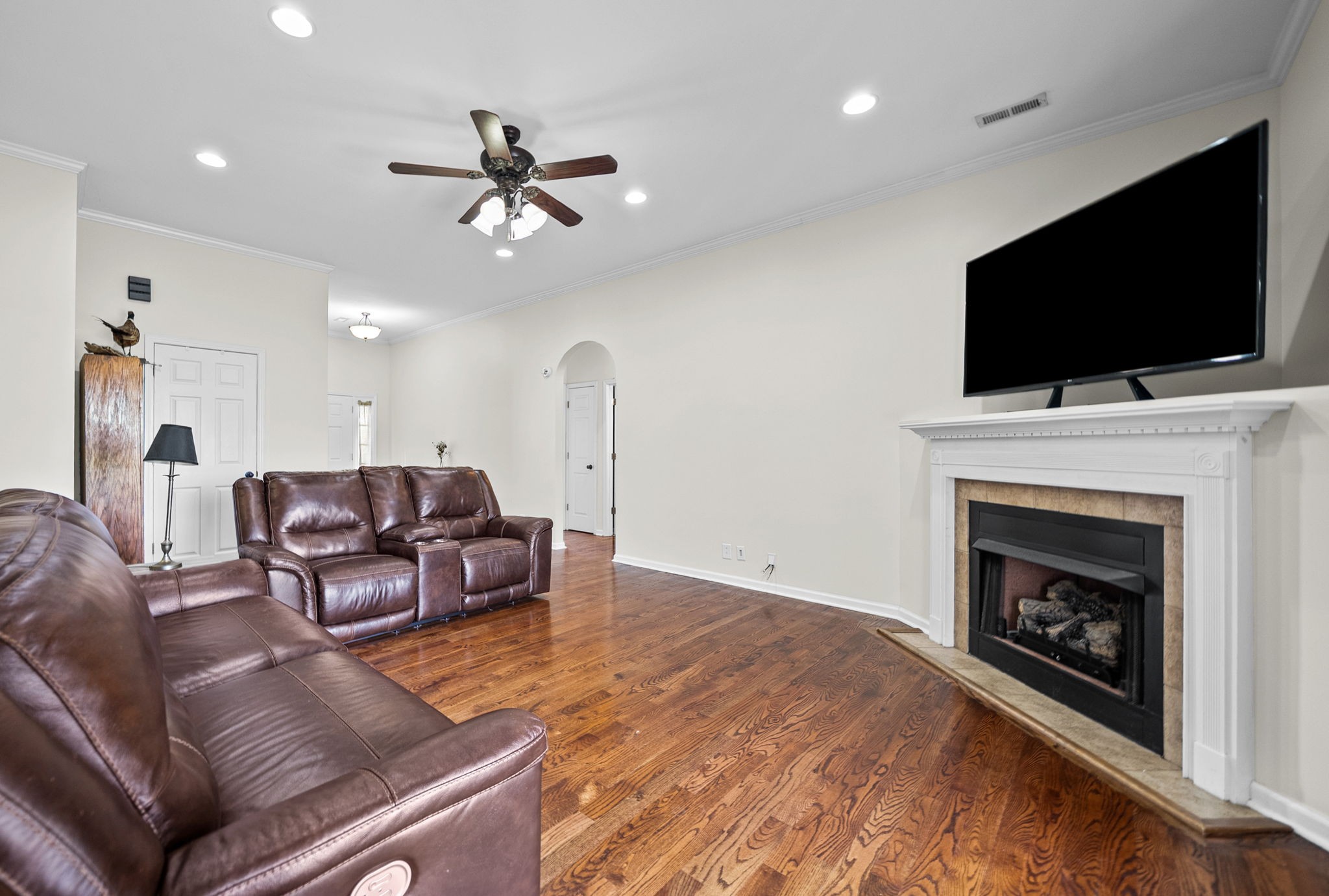 195 Barkers Mill Road Pembroke, KY 42266 - Photo 4 of 39 a living room with furniture a fireplace and a flat screen tv