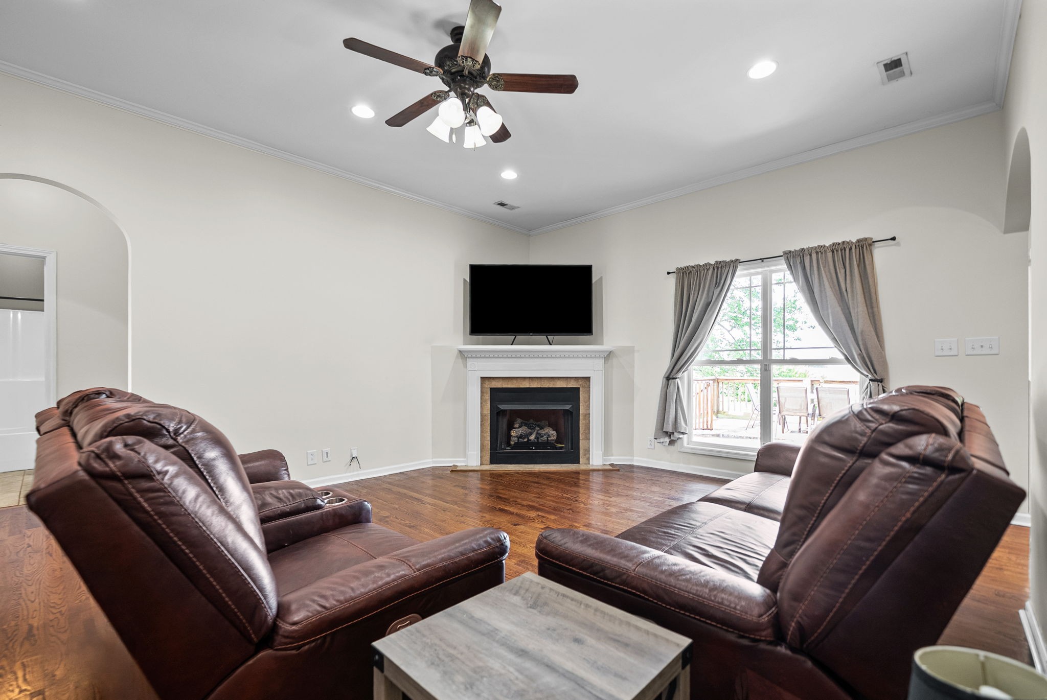 195 Barkers Mill Road Pembroke, KY 42266 - Photo 6 of 39 a living room with furniture a fireplace and a flat screen tv