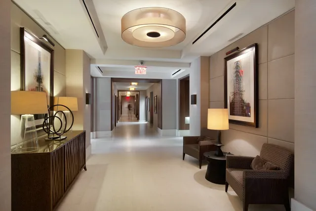 a lobby with furniture and ceiling fan