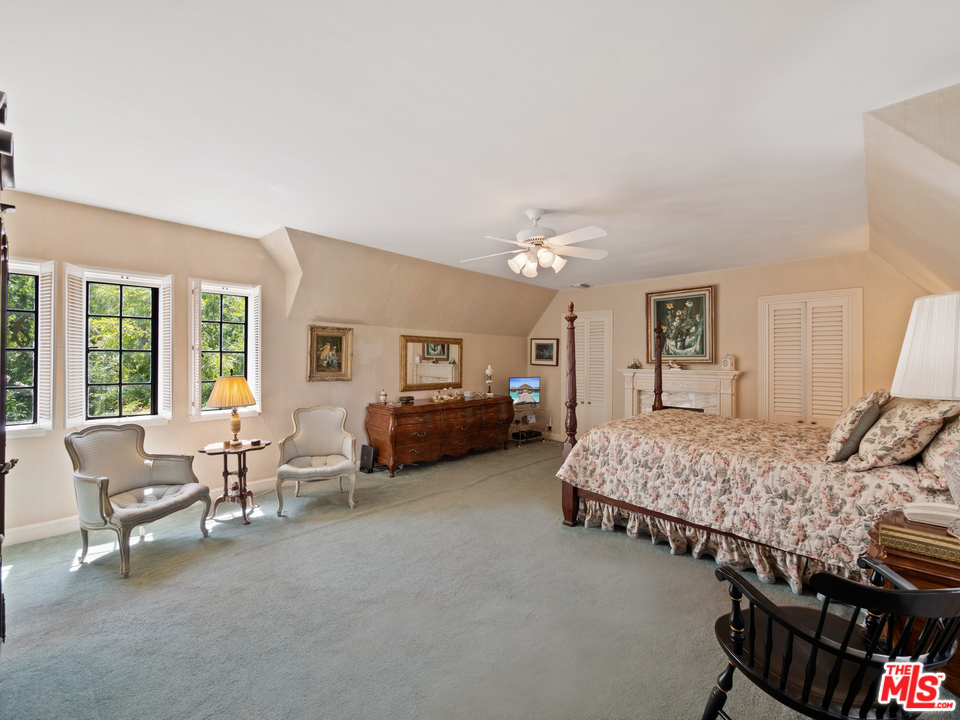 810 Devon Avenue Los Angeles, CA 90024 - Photo 11 of 23 a living room with furniture and a chandelier