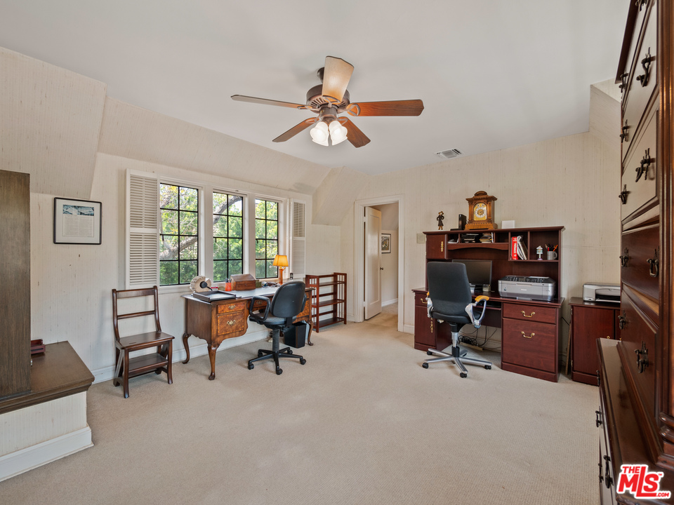810 Devon Avenue Los Angeles, CA 90024 - Photo 16 of 23 a view of a workspace with furniture and a window