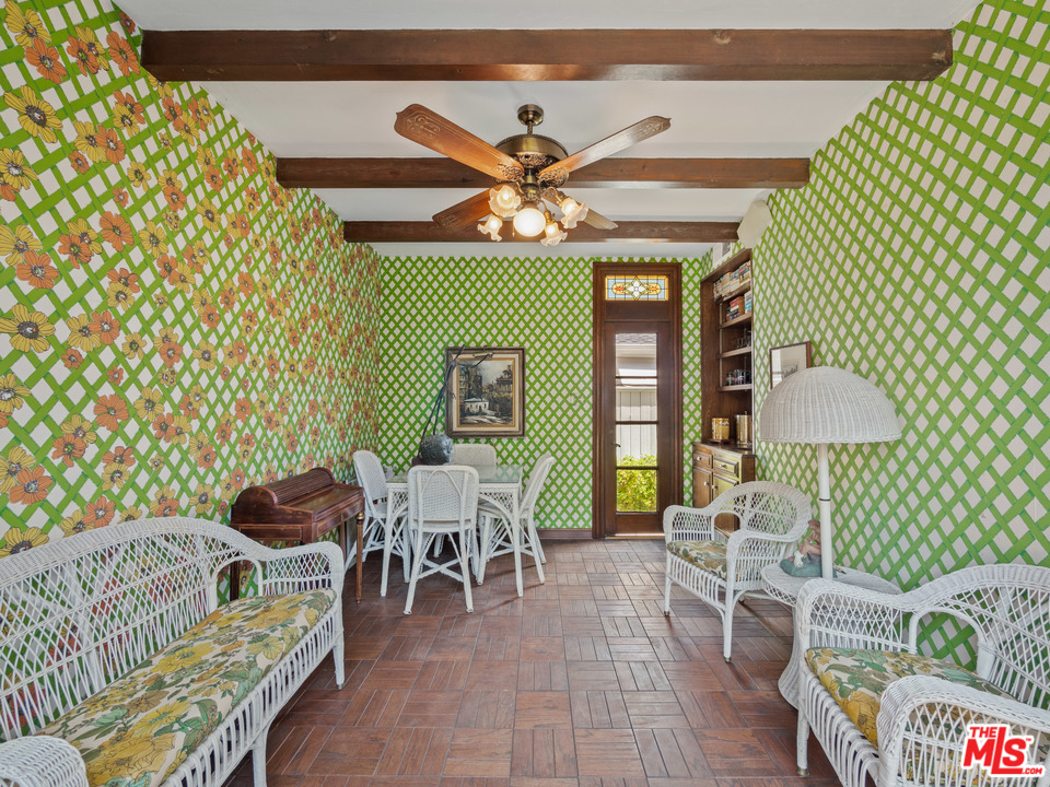810 Devon Avenue Los Angeles, CA 90024 - Photo 17 of 23 a living room with furniture and a lamp