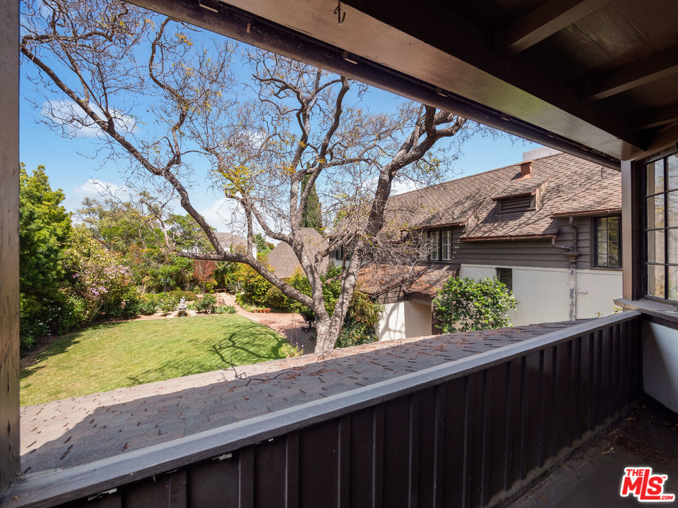810 Devon Avenue Los Angeles, CA 90024 - Photo 18 of 23 a wooden bench sitting in front of a building