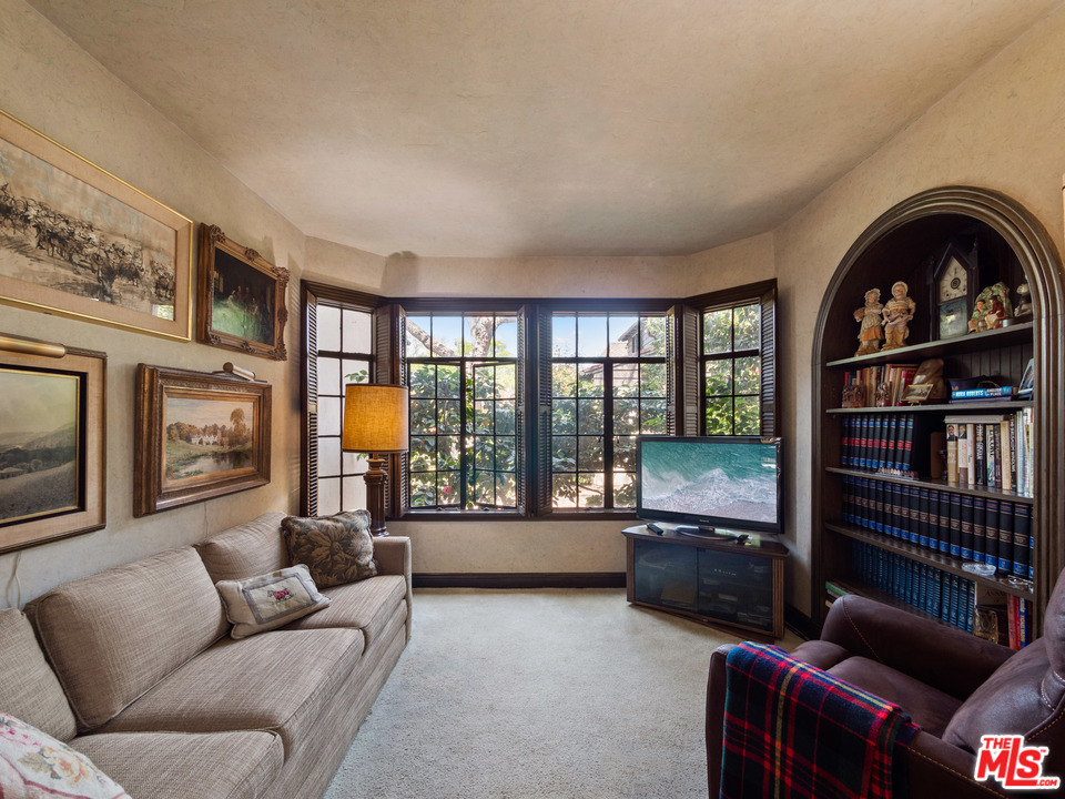 810 Devon Avenue Los Angeles, CA 90024 - Photo 9 of 23 a living room with furniture and a floor to ceiling window