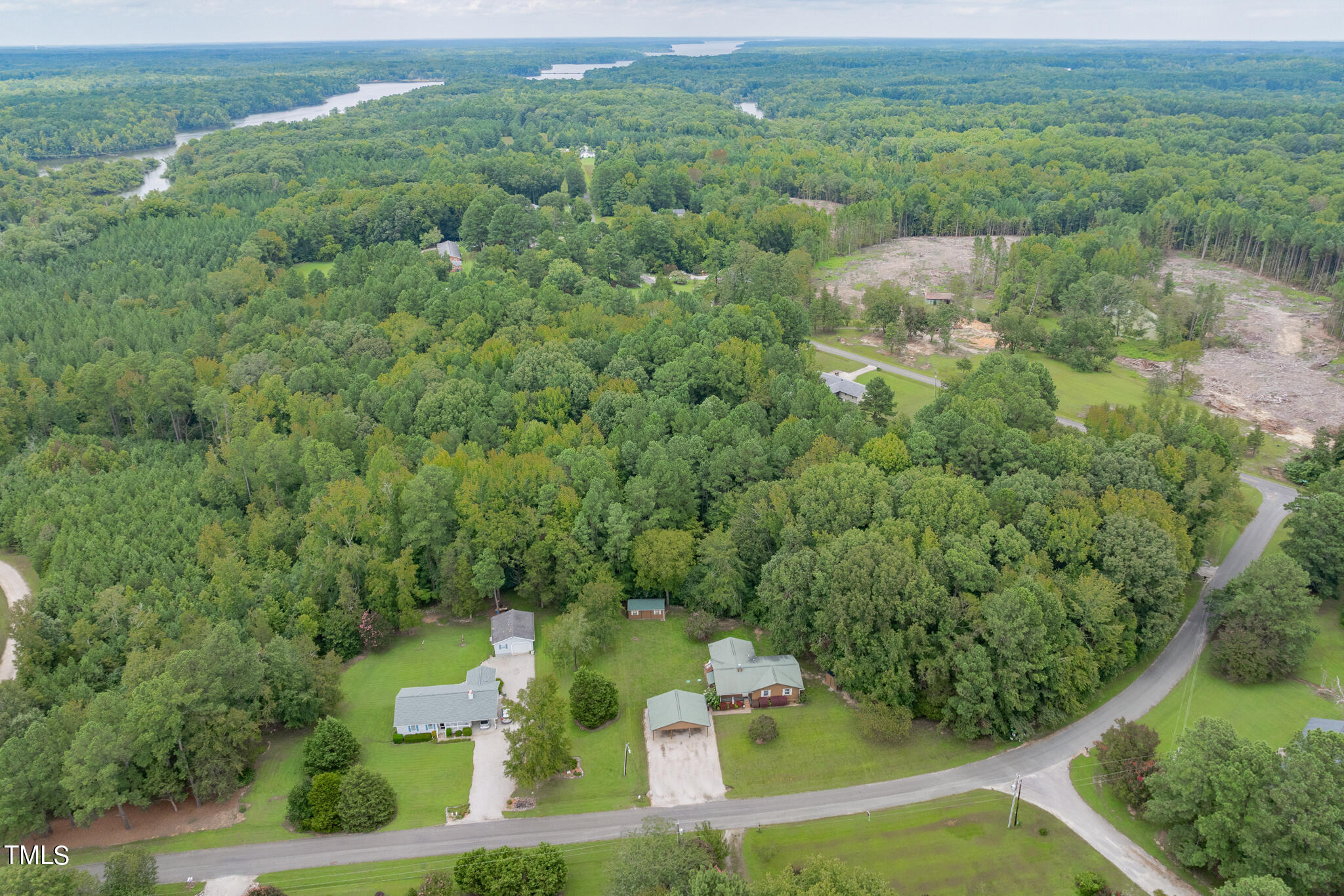 110 Lake Road Henderson, NC 27537 - Photo 35 of 36 an aerial view of residential houses with outdoor space and trees