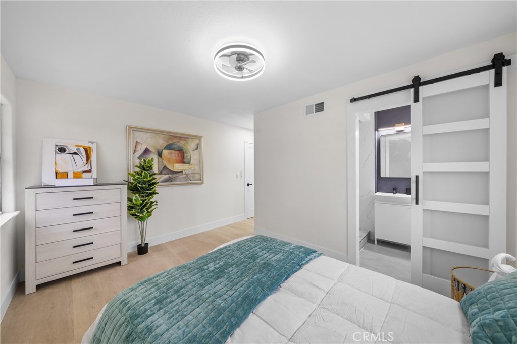 2717 West 6th Street Rialto, CA 92376 - Photo 14 of 30 a bedroom with a bed and furniture