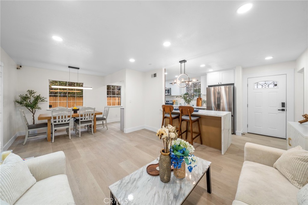 2717 West 6th Street Rialto, CA 92376 - Photo 19 of 30 a living room with furniture and kitchen view