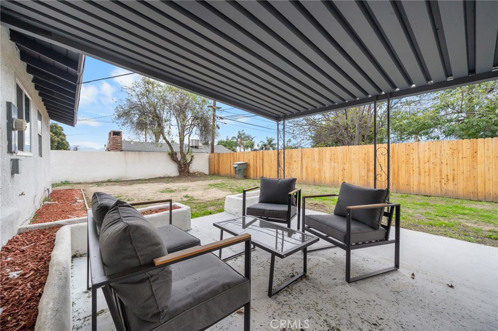 2717 West 6th Street Rialto, CA 92376 - Photo 24 of 30 a backyard of a house with outdoor seating