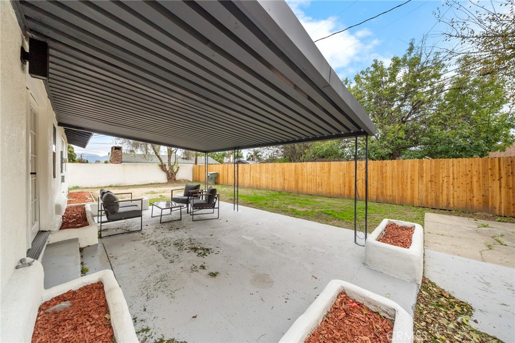 2717 West 6th Street Rialto, CA 92376 - Photo 25 of 30 a backyard of a house with table and chairs