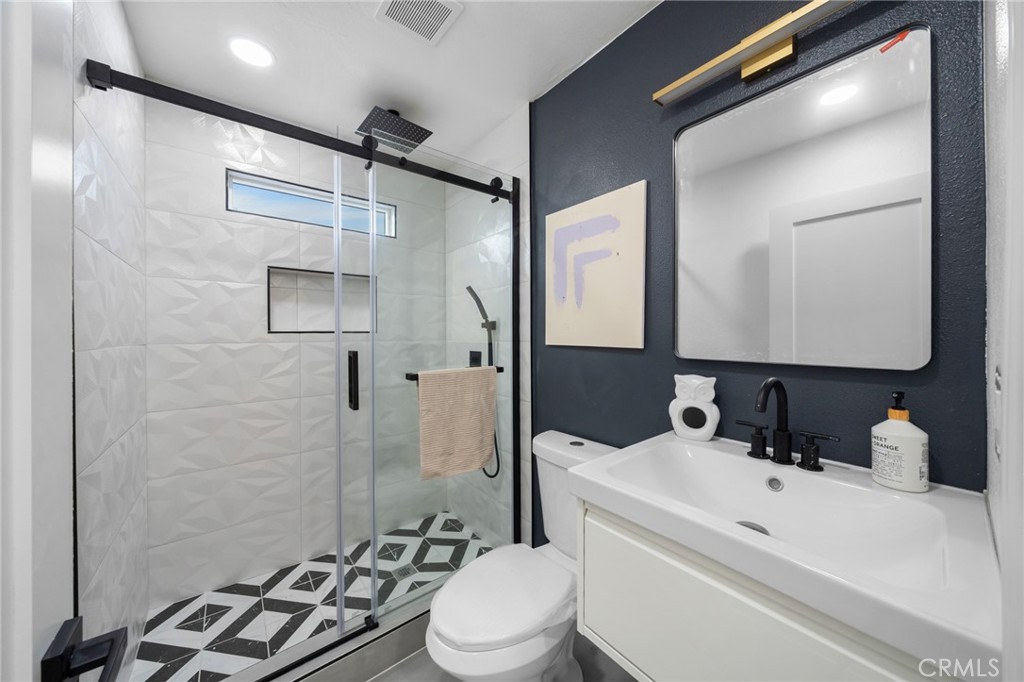 2717 West 6th Street Rialto, CA 92376 - Photo 10 of 30 a bathroom with a sink toilet and shower