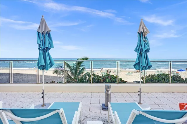 a dining room with a table and chairs