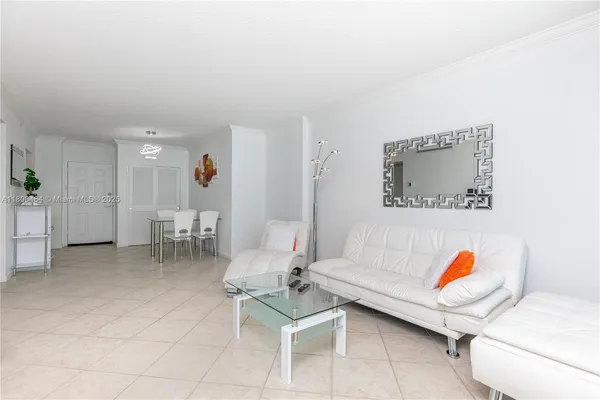 a living room with furniture and a table