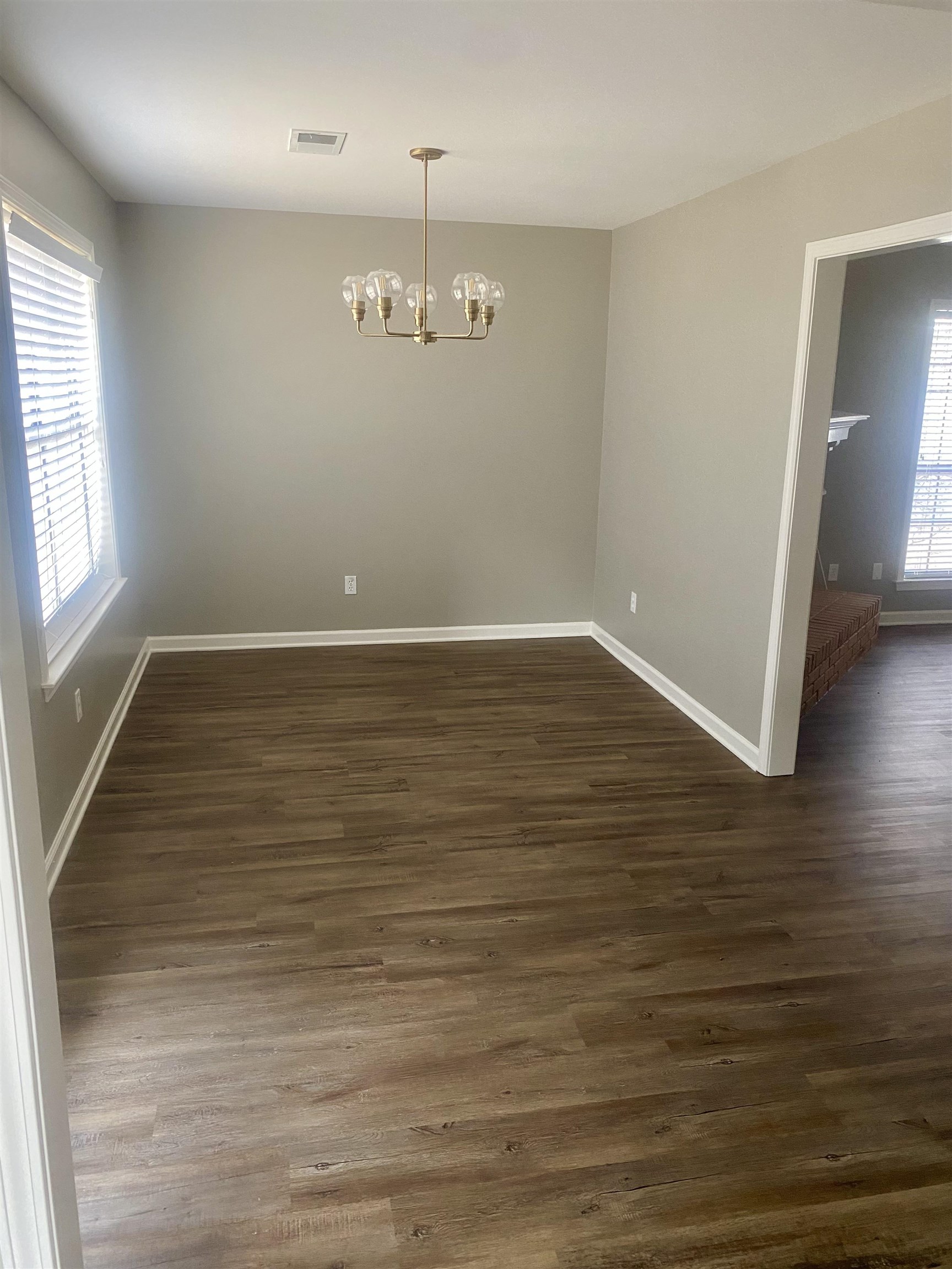 1167 Junco Cove Collierville, TN 38017 - Photo 11 of 25 an empty room with wooden floor and windows