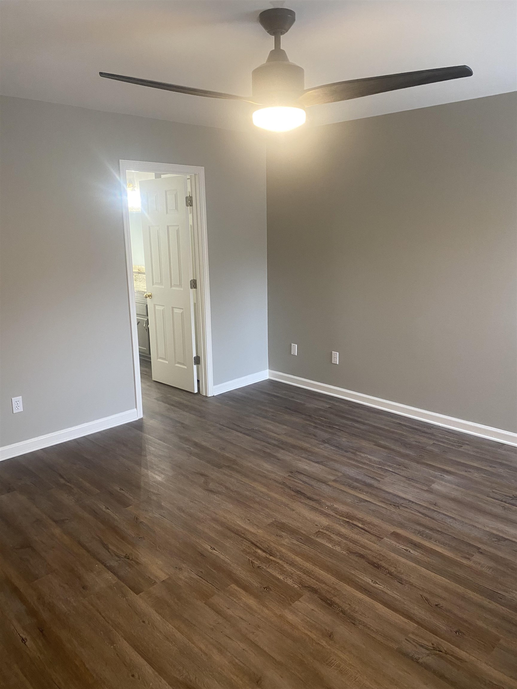 1167 Junco Cove Collierville, TN 38017 - Photo 13 of 25 a view of an empty room with wooden floor