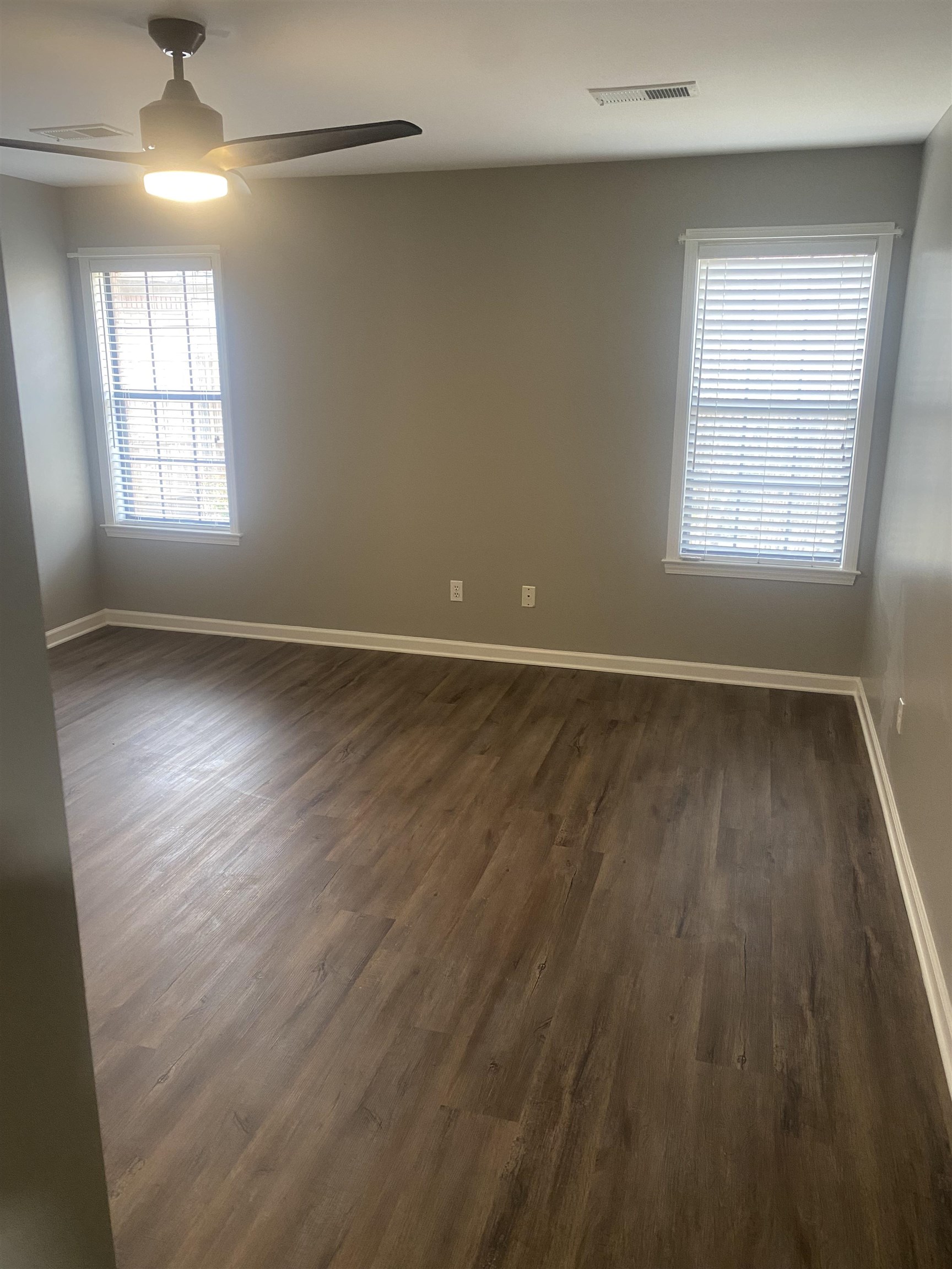 1167 Junco Cove Collierville, TN 38017 - Photo 14 of 25 wooden floor in an empty room with a window