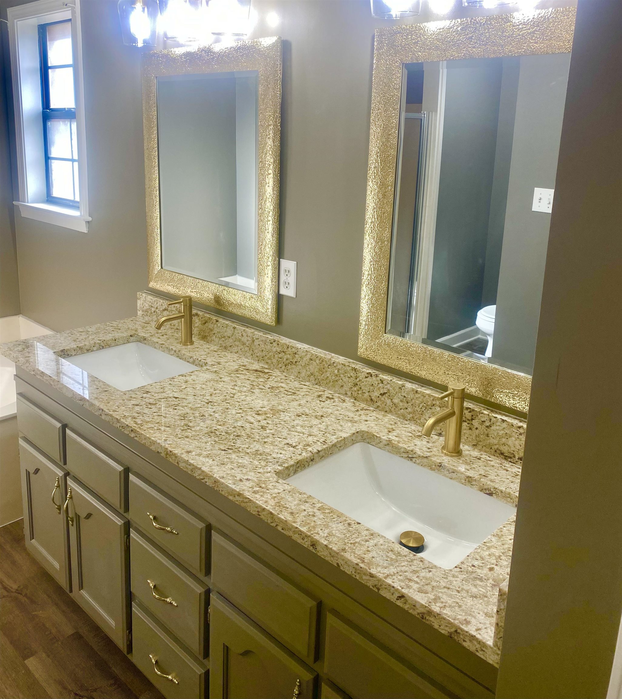 1167 Junco Cove Collierville, TN 38017 - Photo 16 of 25 a bathroom with a granite countertop sink and a mirror