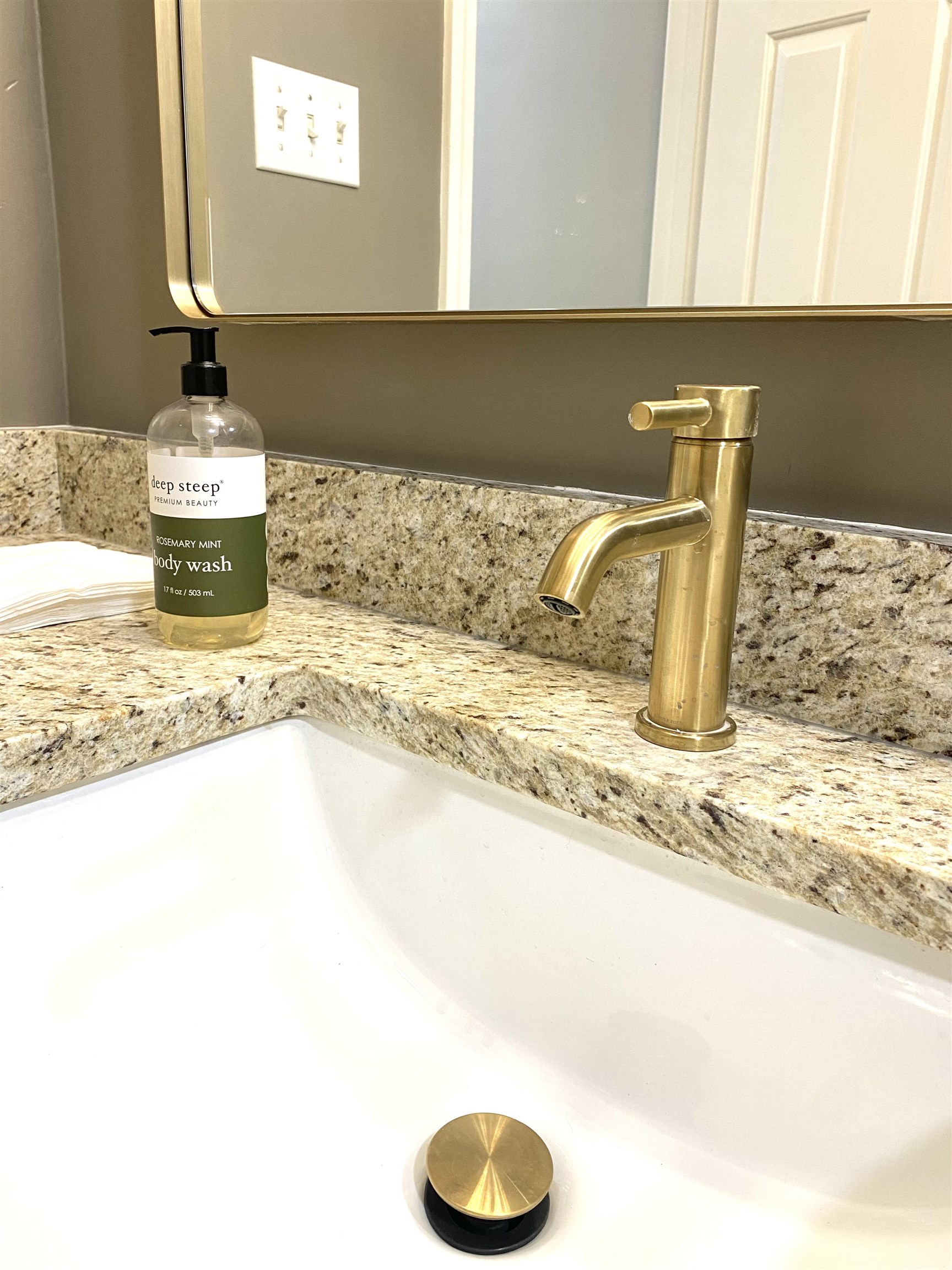 1167 Junco Cove Collierville, TN 38017 - Photo 20 of 25 a bathroom with a granite countertop sink and a mirror