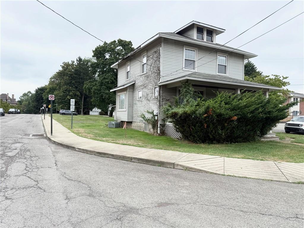 320 Reis Street New Castle, PA 16101 - Photo 1 of 18 a front view of a house with a yard