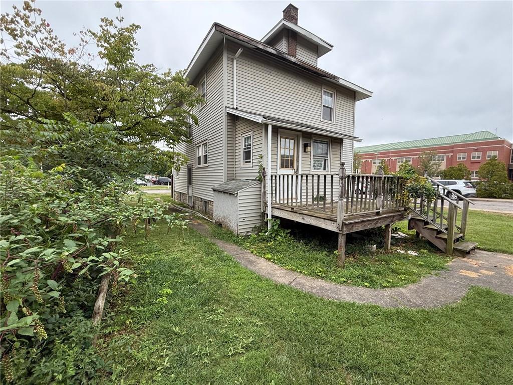 320 Reis Street New Castle, PA 16101 - Photo 4 of 18 a view of a house with a yard and deck