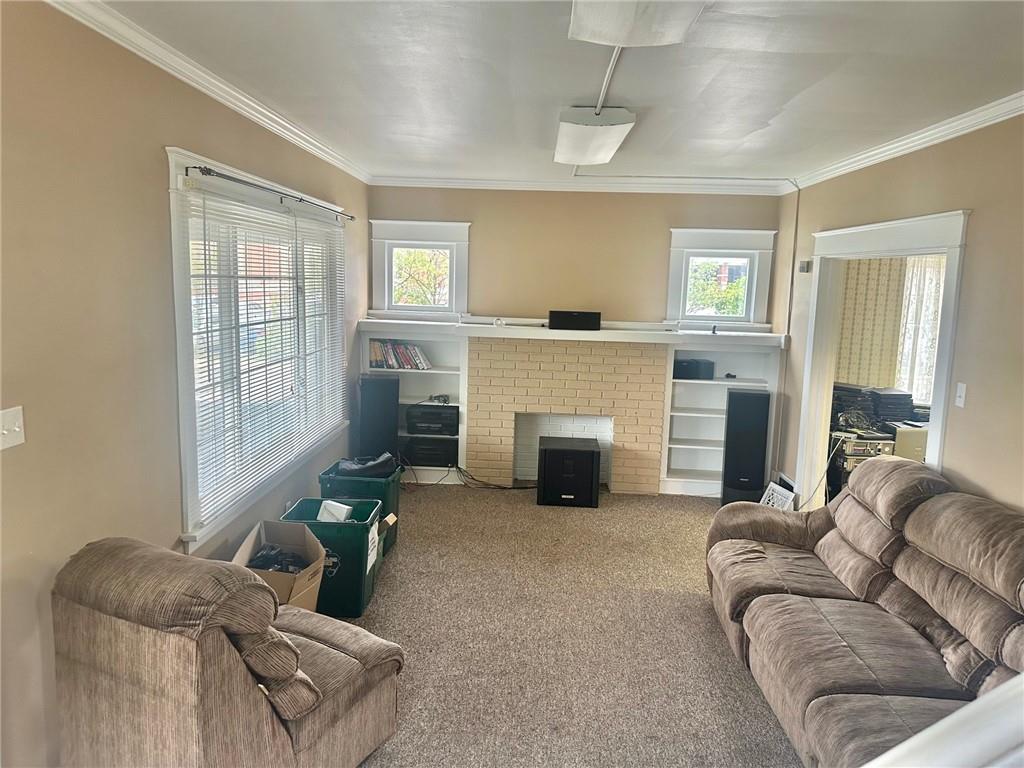 320 Reis Street New Castle, PA 16101 - Photo 6 of 18 a living room with furniture and a fireplace