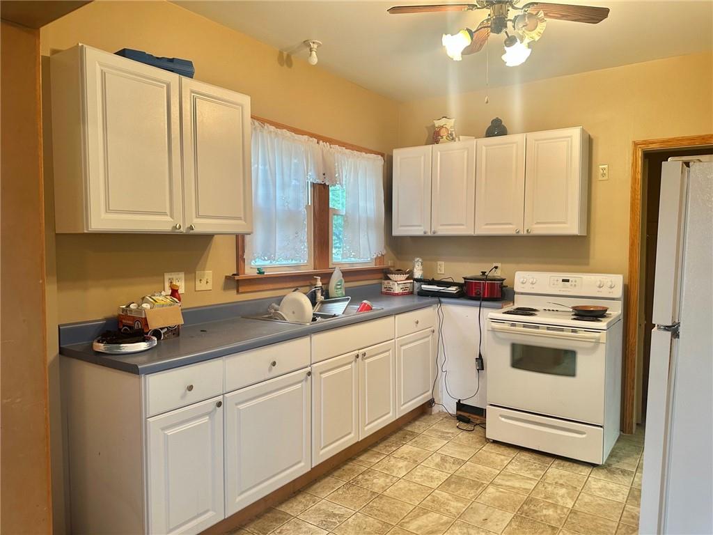 320 Reis Street New Castle, PA 16101 - Photo 7 of 18 a kitchen with a sink and cabinets