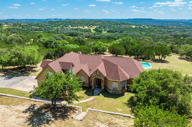 an aerial view of a house with a garden