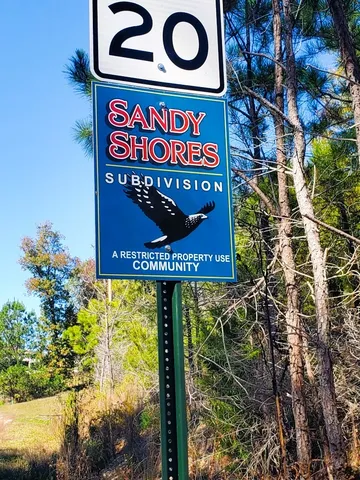 a view of a pathway with a yard