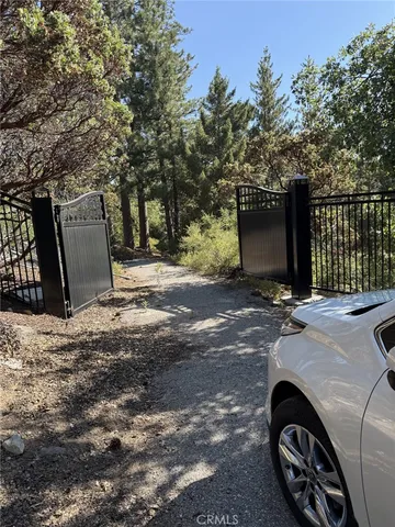 a view of a backyard space of a house