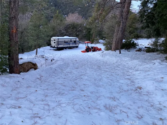 a car parked in front of a white house