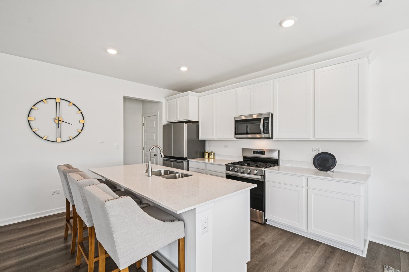 2461 Semillon Street Oswego, IL 60543 - Photo 13 of 45 a kitchen with a dining table chairs and a refrigerator