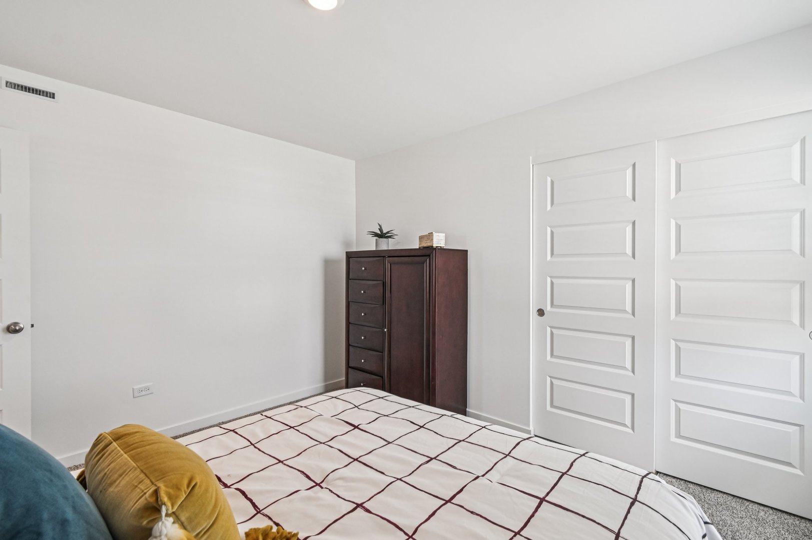 2461 Semillon Street Oswego, IL 60543 - Photo 37 of 45 a bedroom with a bed and cabinets