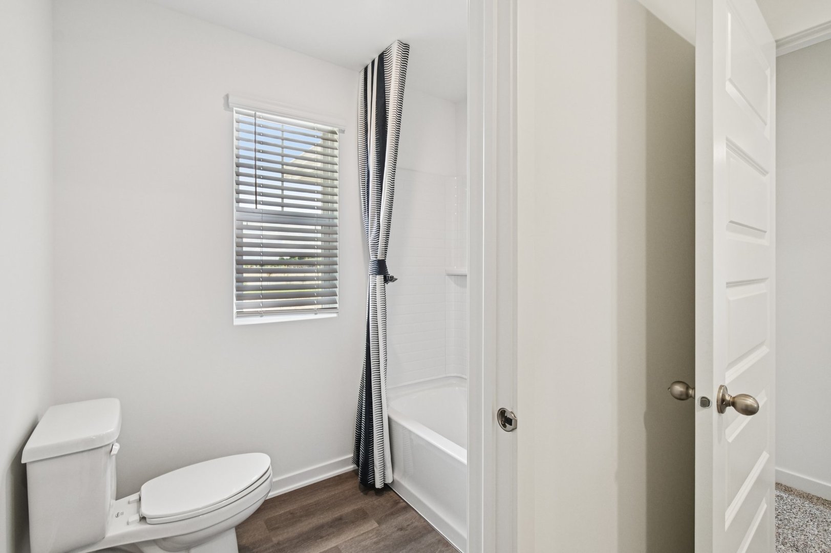 2461 Semillon Street Oswego, IL 60543 - Photo 39 of 45 a white toilet sitting next to a small bathroom
