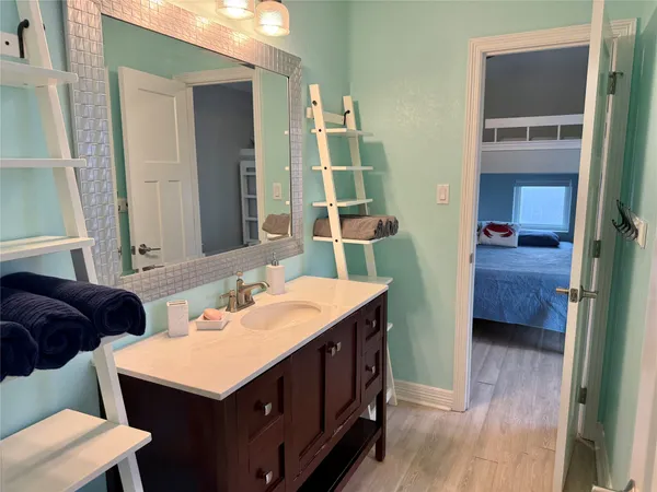 a bathroom with a double vanity sink and a mirror