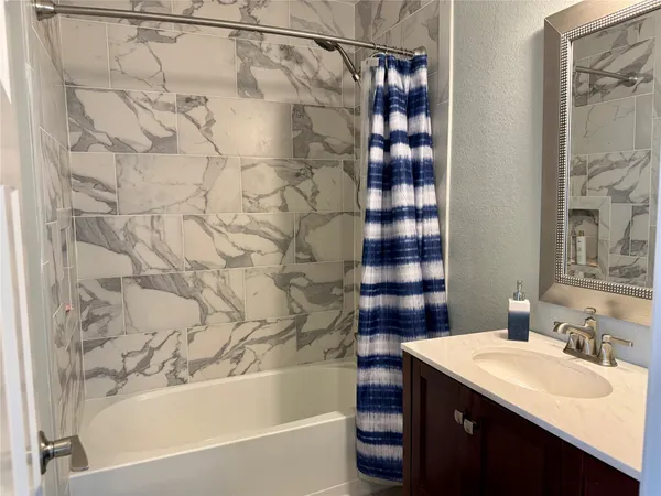 a bathroom with a sink and a bathtub