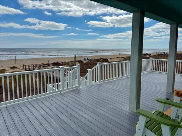 a view of a balcony with wooden floor