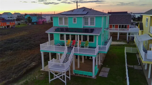 a front view of a house with a yard table and chairs
