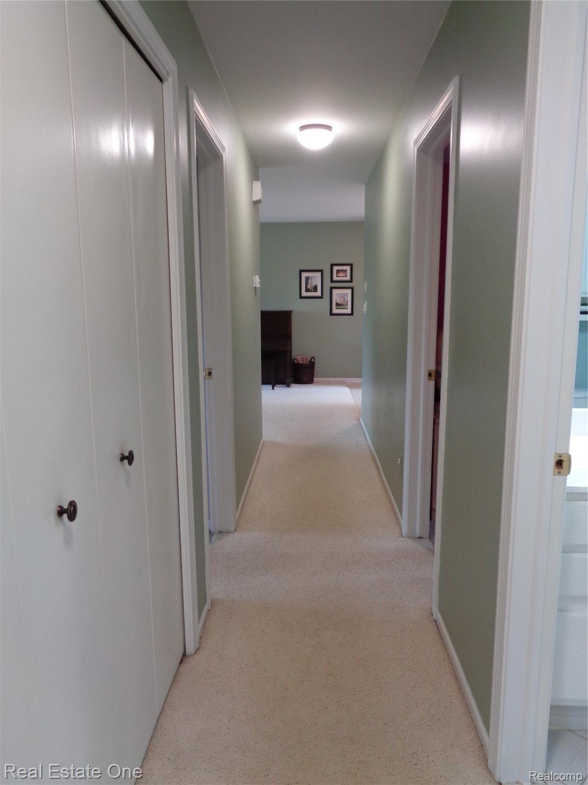 2572 Lake George Road Oakland, MI 48363 - Photo 29 of 83 Entry level hallway with linen closet and new fixtures