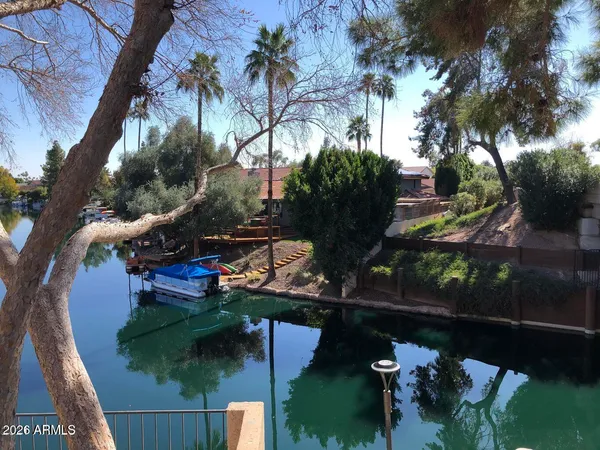 a view of house with swimming pool outdoor seating