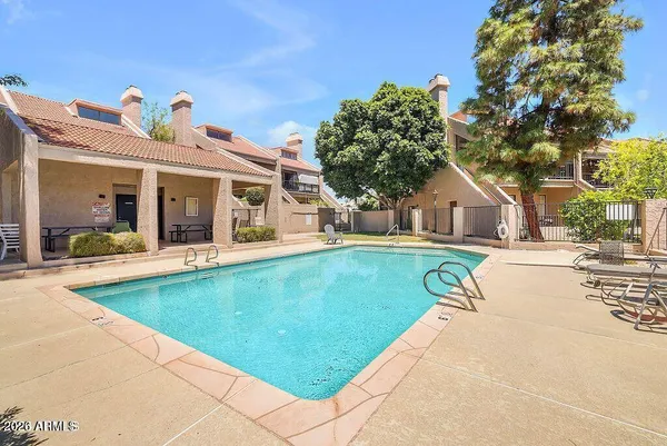 a view of a park and houses