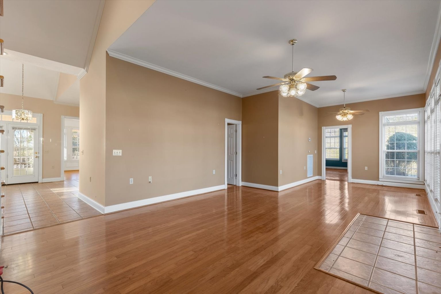 3160 Tom Holt Road Clifton, TN 38425 - Photo 19 of 53 a view of an empty room with window and wooden floor