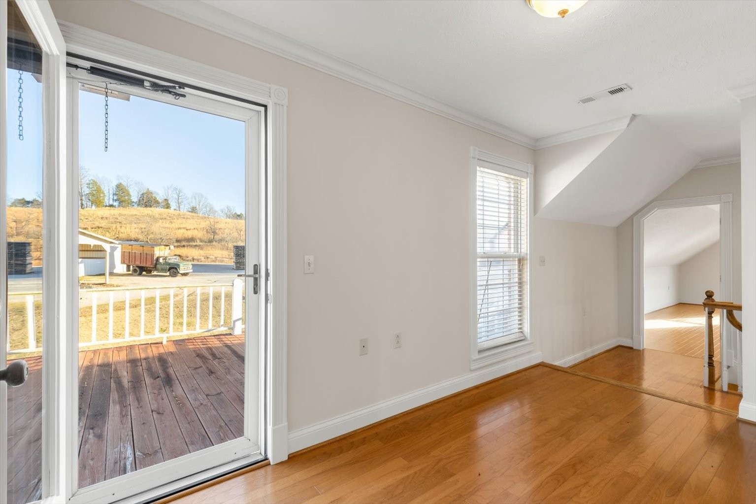 3160 Tom Holt Road Clifton, TN 38425 - Photo 22 of 53 a view of empty room with wooden floor and fan