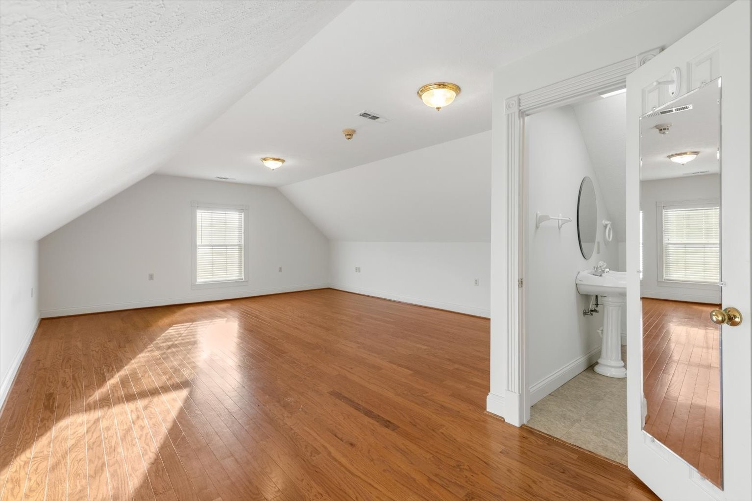 3160 Tom Holt Road Clifton, TN 38425 - Photo 25 of 53 a view of empty room with wooden floor and fan