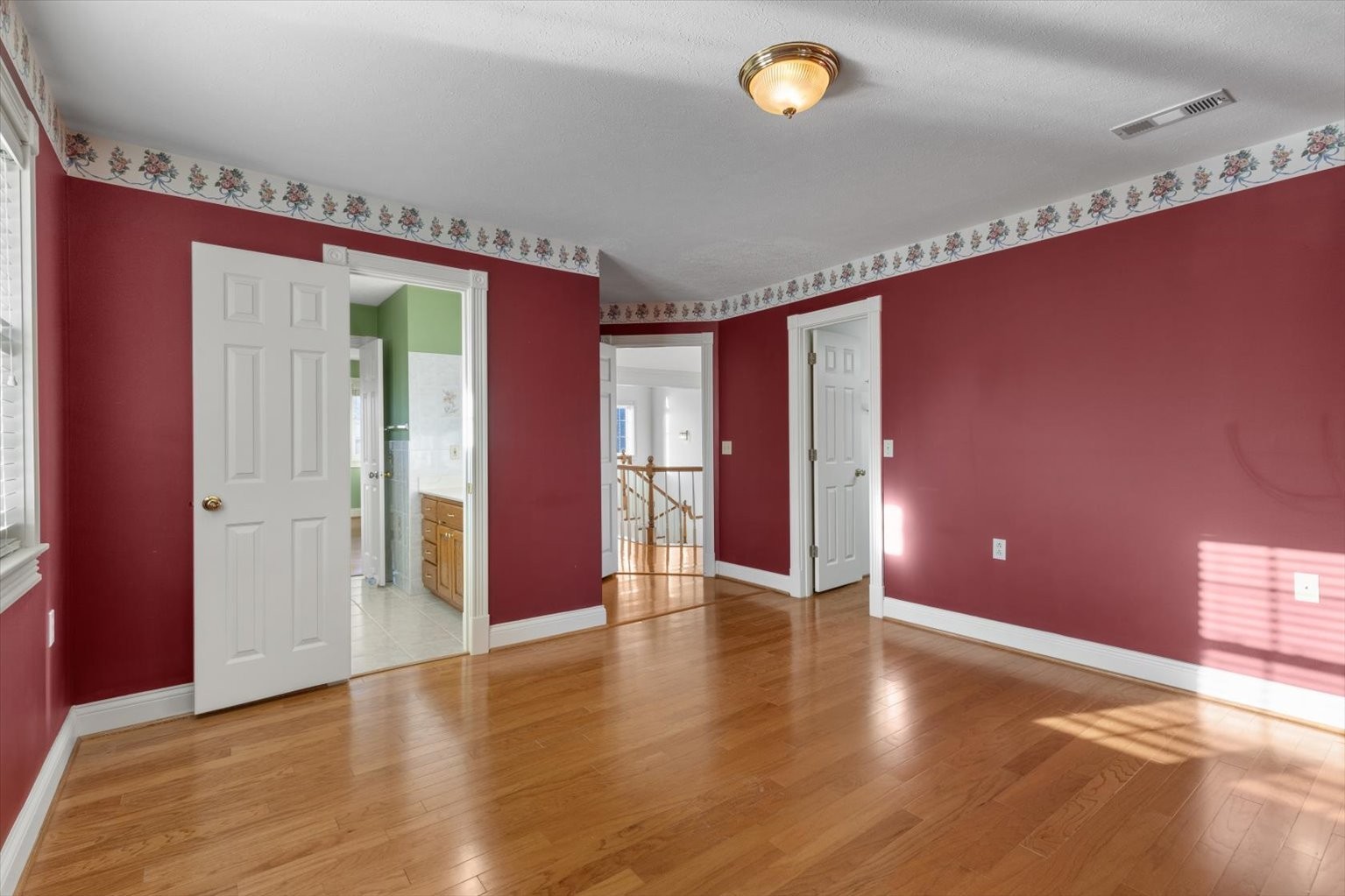 3160 Tom Holt Road Clifton, TN 38425 - Photo 29 of 53 a view of an empty room with wooden floor and windows