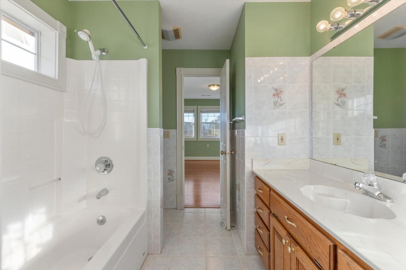 3160 Tom Holt Road Clifton, TN 38425 - Photo 30 of 53 a bathroom with a bathtub and a sink