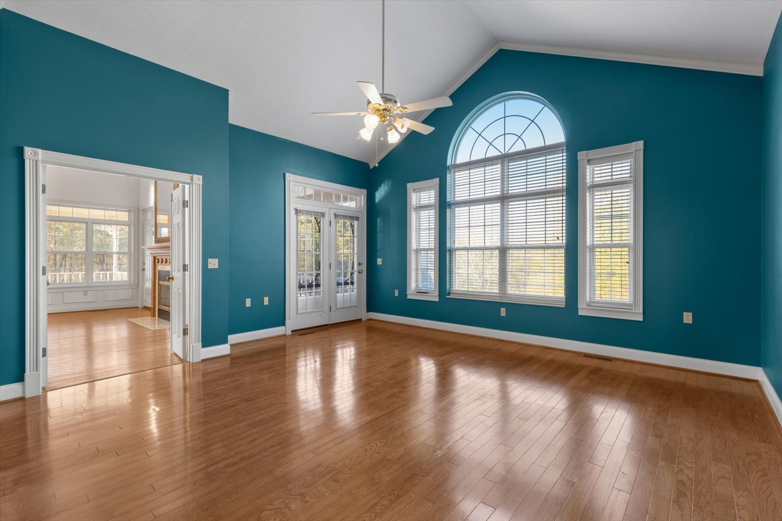 3160 Tom Holt Road Clifton, TN 38425 - Photo 35 of 53 a view of an empty room with window and wooden floor