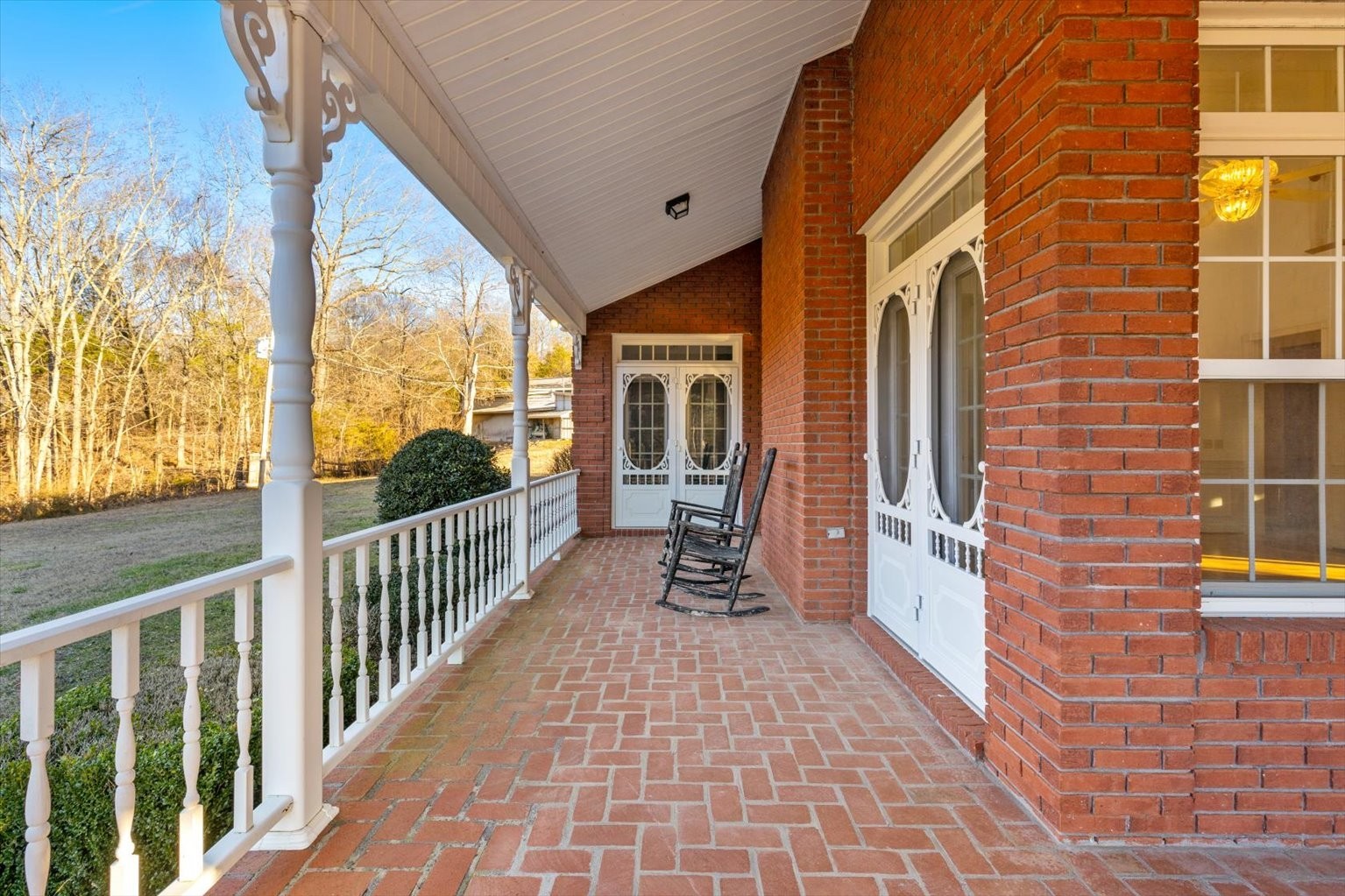 3160 Tom Holt Road Clifton, TN 38425 - Photo 41 of 53 a porch with a bench next to a road